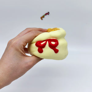 Lucky Gold Coin Pouch Squeeze Toy: Good Luck by Your SideSuper So - slow rising squeeze toy side angle view