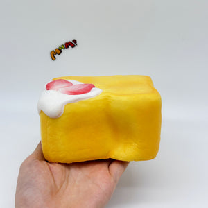 Cute Piano Bread Stress Relief Squishy - slow rising squeeze toy side angle view