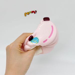 Pink Banana Slow Rise Squishy Toy - slow rising squeeze toy side angle view