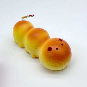 Fluffy Caterpillar Bread Squishy - slow rising squeeze toy side angle view