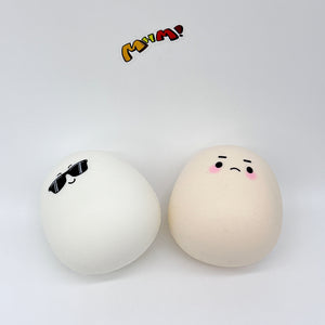 Boiled eggs and raw eggs, gently squish and have fun! - soft slow rise fidget toy front view