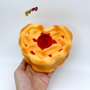 Heart-Shaped Cherry Pie Squishy | Slow Rising Food Stress Relief - slow rising squeeze toy side angle view
