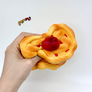 Heart-Shaped Cherry Pie Squishy | Slow Rising Food Stress Relief - squishy toy size reference with hand