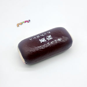 Tamagoyaki Squishy - Yellow & Chocolate Japanese Thick Egg Omelet - slow rise fidget toy texture close up