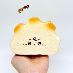 Milk Haas Bread Squishy - Chocolate Brown & Original Bread Yellow - squishy toy size reference with hand