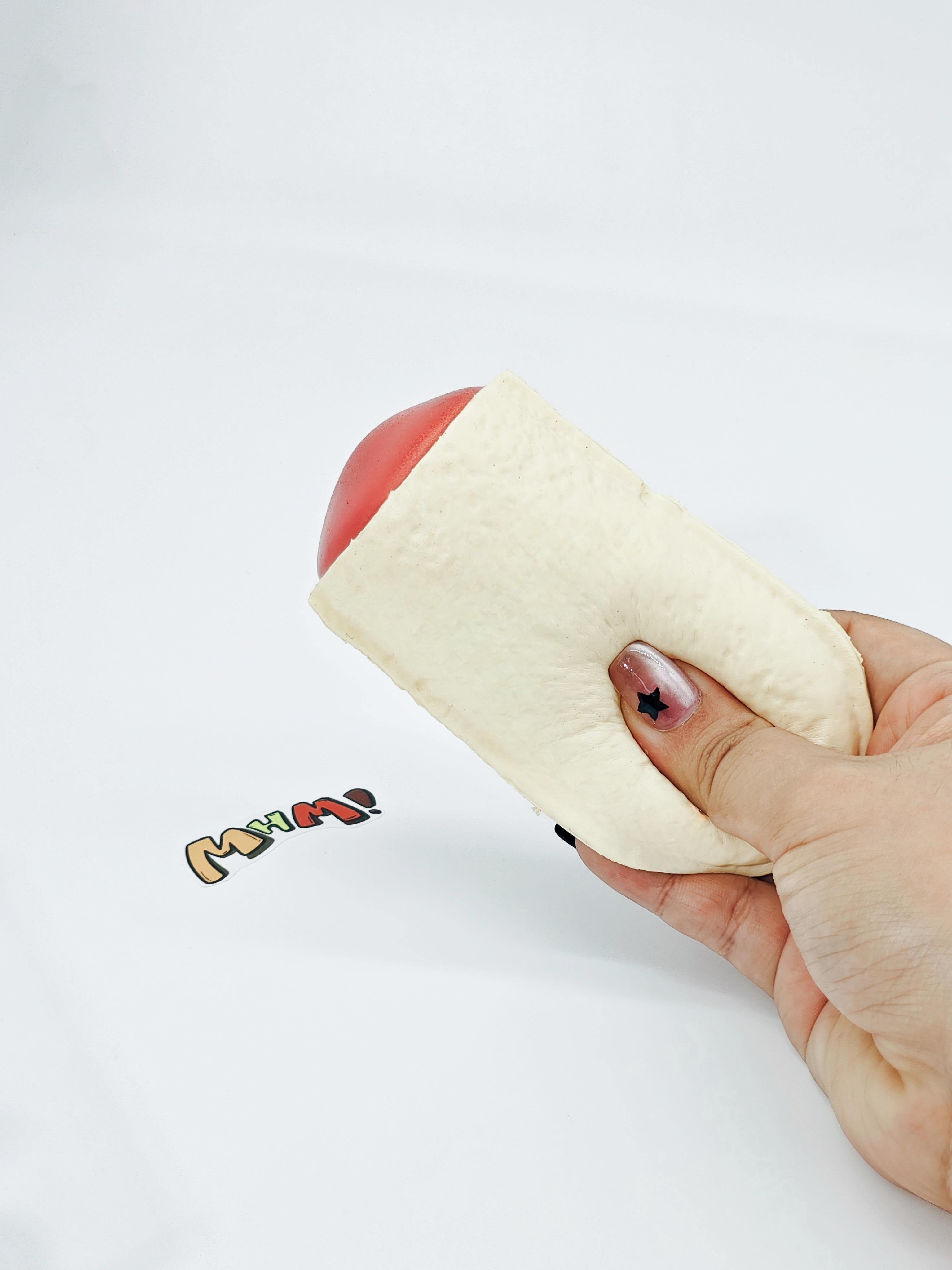 Hand squeezing sticky lactic acid bacteria bottle toy showing slow rising foam texture