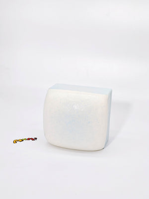 Sea Salt White Chocolate Cake - squishy toy size reference with hand