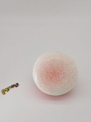 Close up of pastel pink cake roll texture with sticky glaze finish on soft PU foam squishy