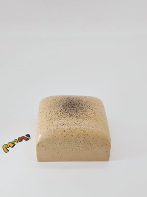 Close up of moist sticky glaze on coffee cake squishy realistic fake food prop for desk