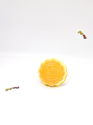 Milk Tea Pudding: Tan Custard Slow Rising Squishy - slow rising squeeze toy side angle view