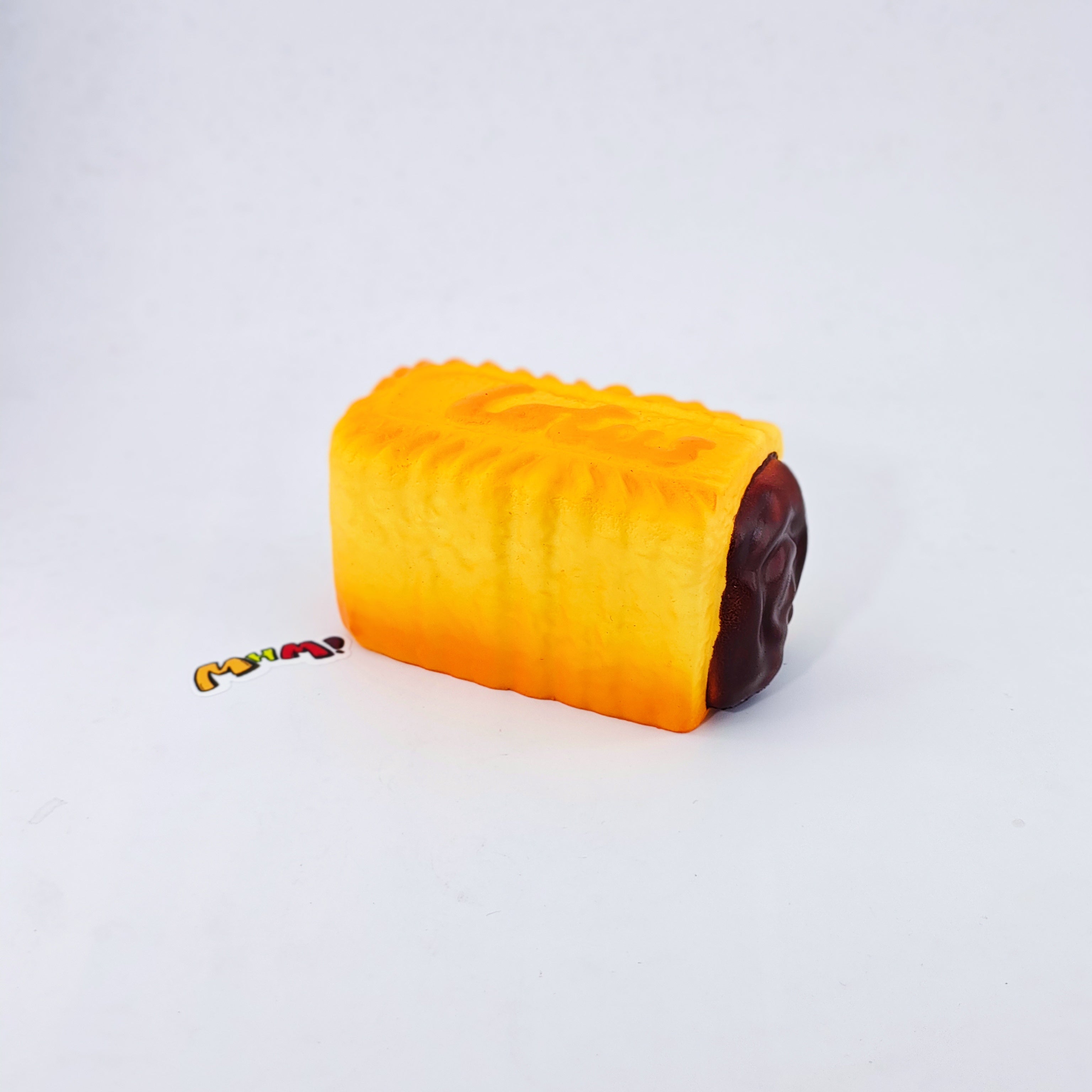 Dark Thick Filled Milk Biscuit Squishy | Snack Themed Slow Rising - soft slow rise fidget toy front view