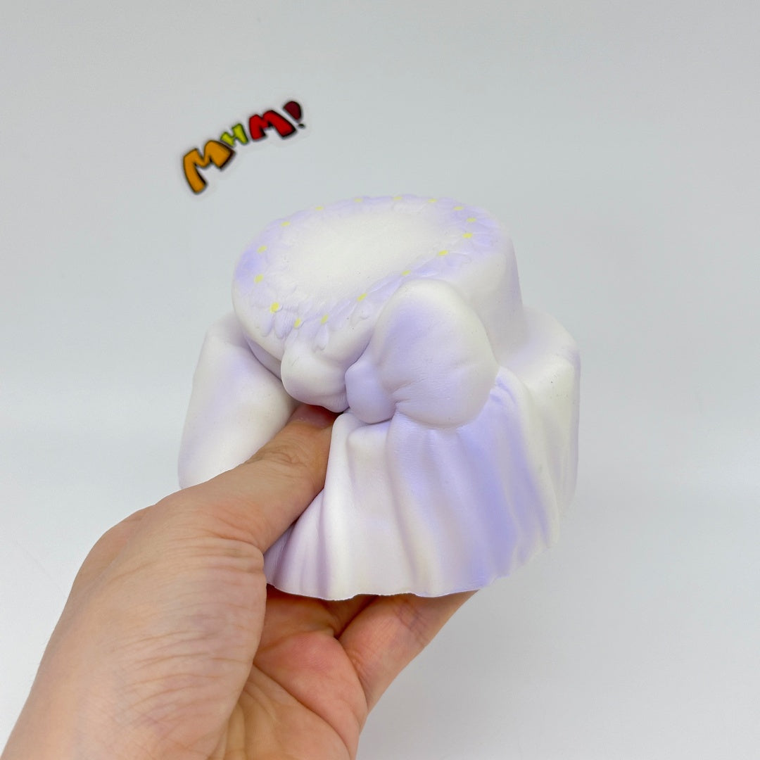 Cute Two-Tier Cake Stress Relief Squishy with Bow - squishy toy size reference with hand