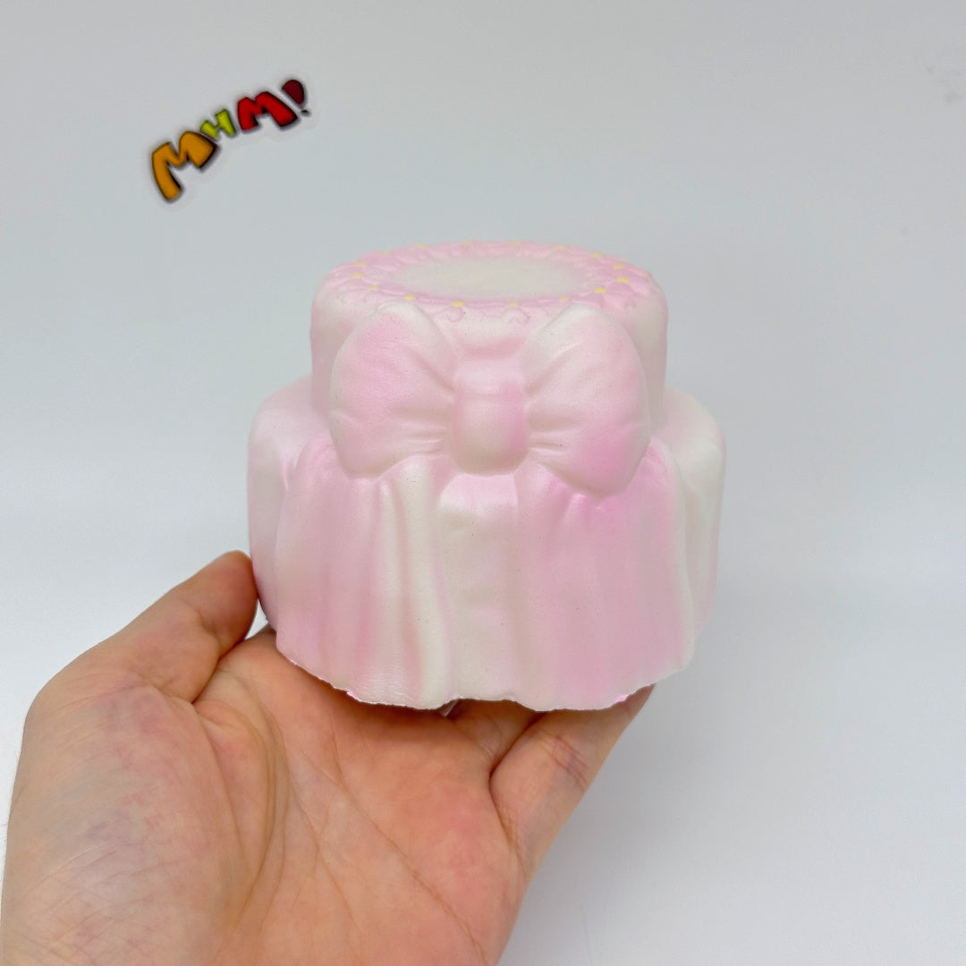 Cute Two-Tier Cake Stress Relief Squishy with Bow - slow rise toy hand squeeze demo