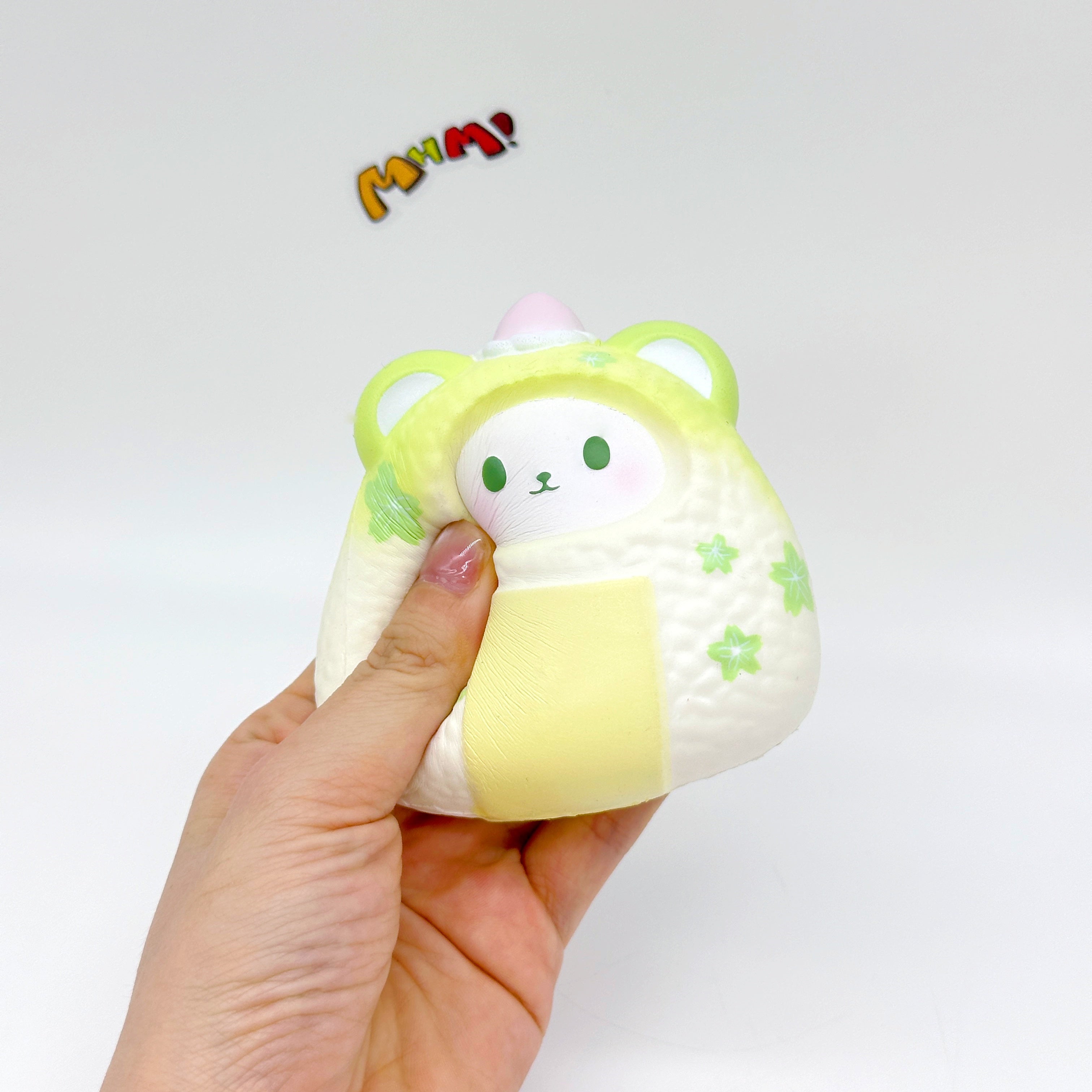 Handheld Bear Onigiri Squishy with Cute Face & Flavor Details - kawaii squishy toy close up