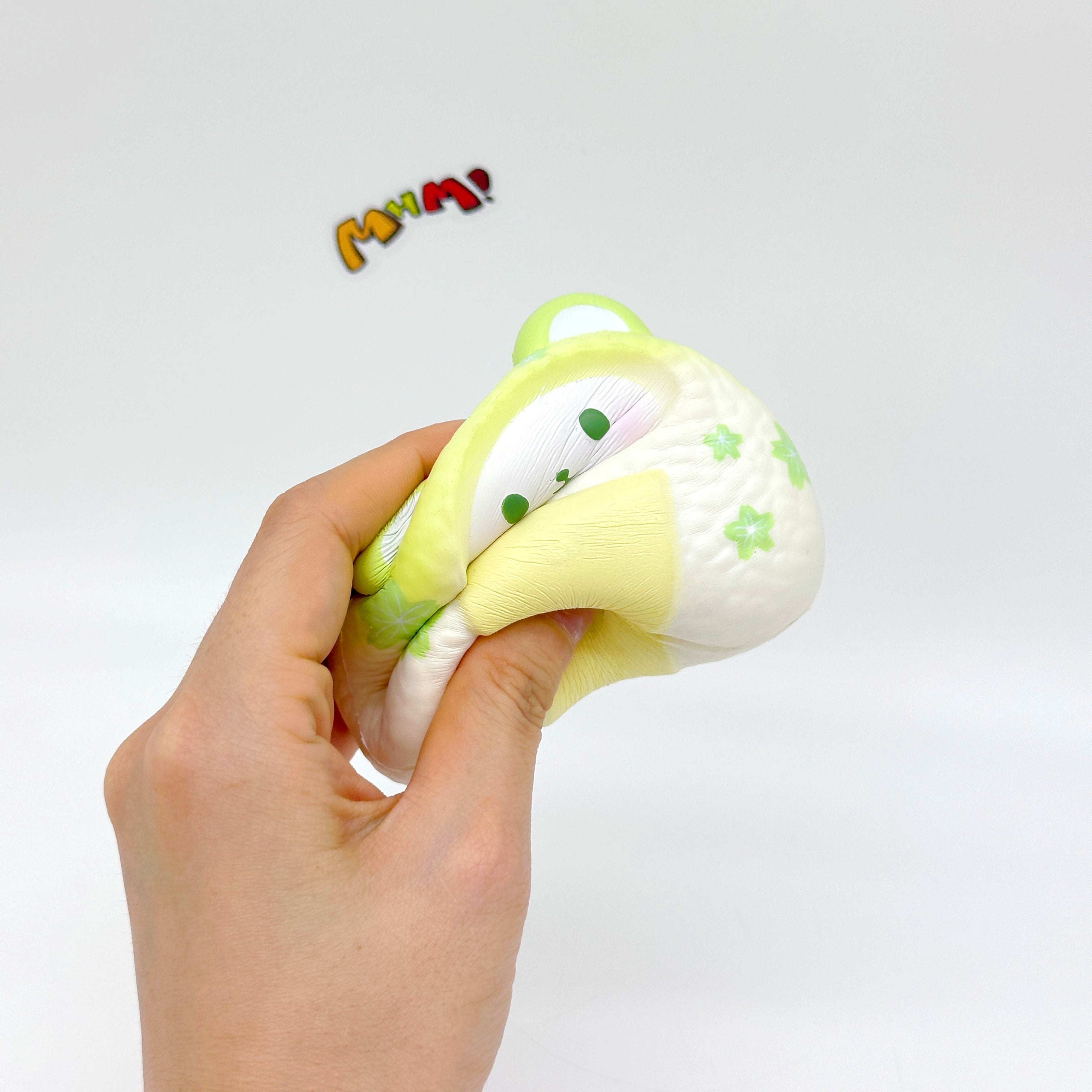Handheld Bear Onigiri Squishy with Cute Face & Flavor Details - squishy toy size reference with hand