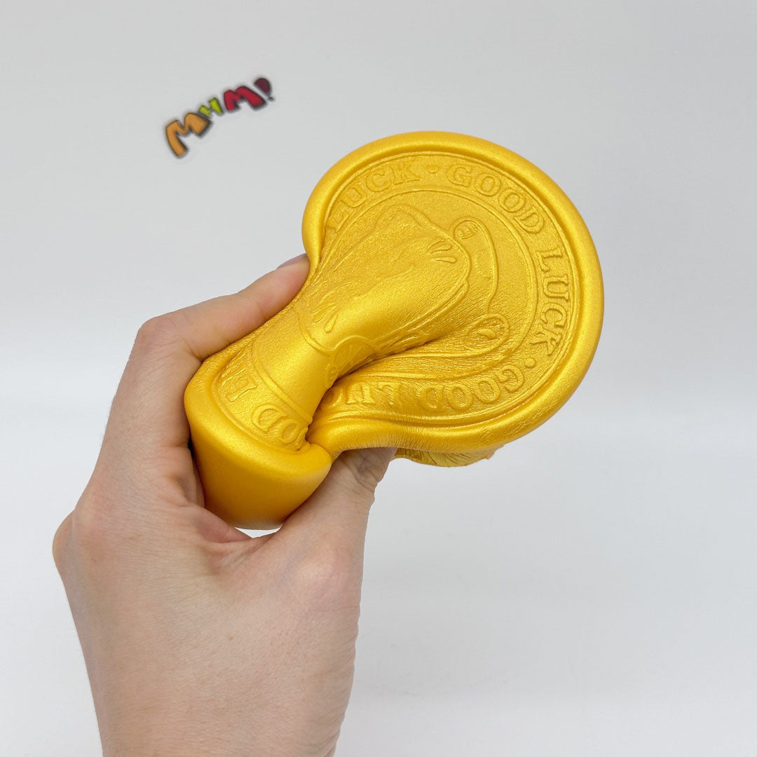 Kawaii Lucky Cat Gold Coin Squishy: Bring Home the Good Luck - squishy toy size reference with hand