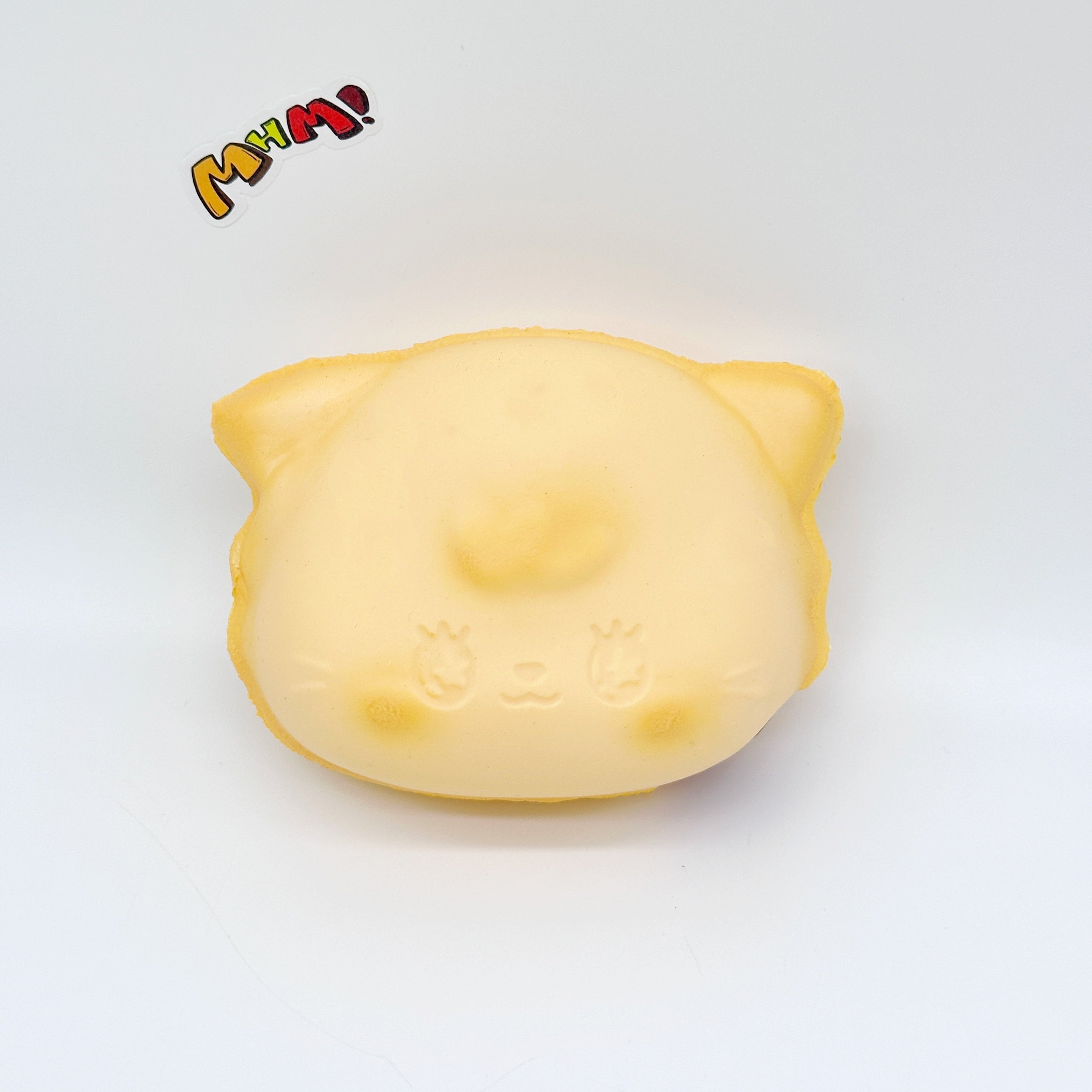 Cat Egg Waffle Slow Rise Squishy Toy - slow rising squeeze toy side angle view