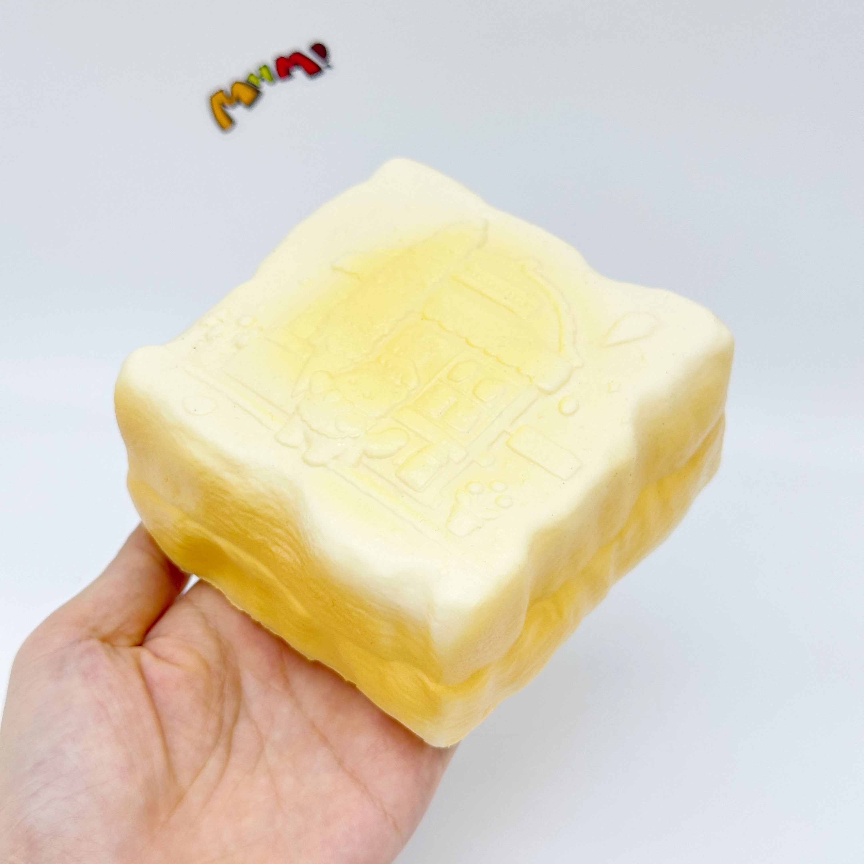 Slow Rise Cute Embossed Toast Squishy Squeeze Away Stress - slow rising squeeze toy side angle view