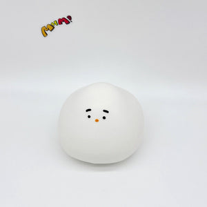 White chonky bird squishy toy with cute mini face, front view on white background