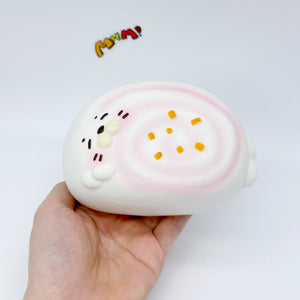 Sleepy Seal Squishy | Cute Pink Swirl Cream Slow Rising Stress Re - slow rising squeeze toy side angle view