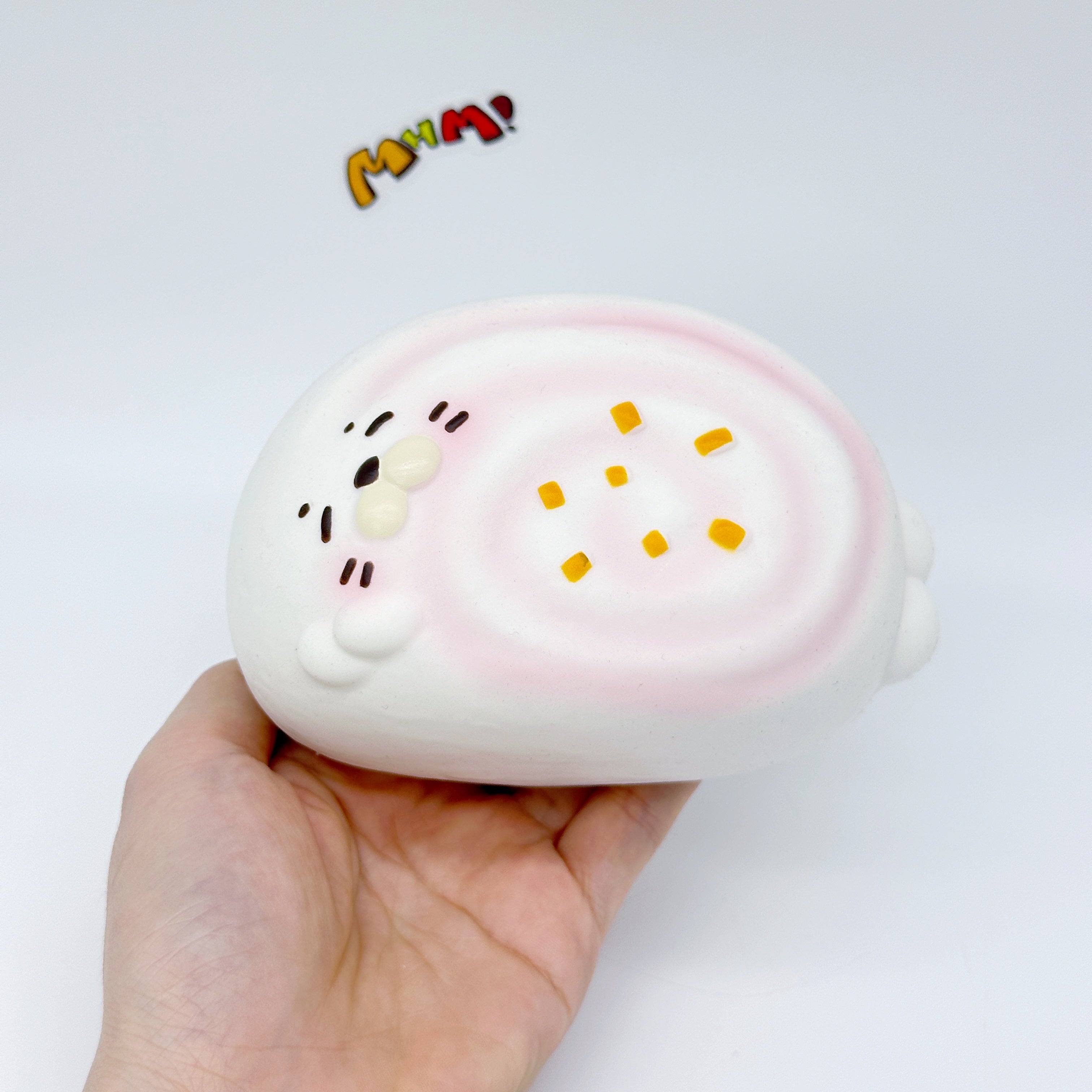 Sleepy Seal Squishy | Cute Pink Swirl Cream Slow Rising Stress Re - slow rising squeeze toy side angle view