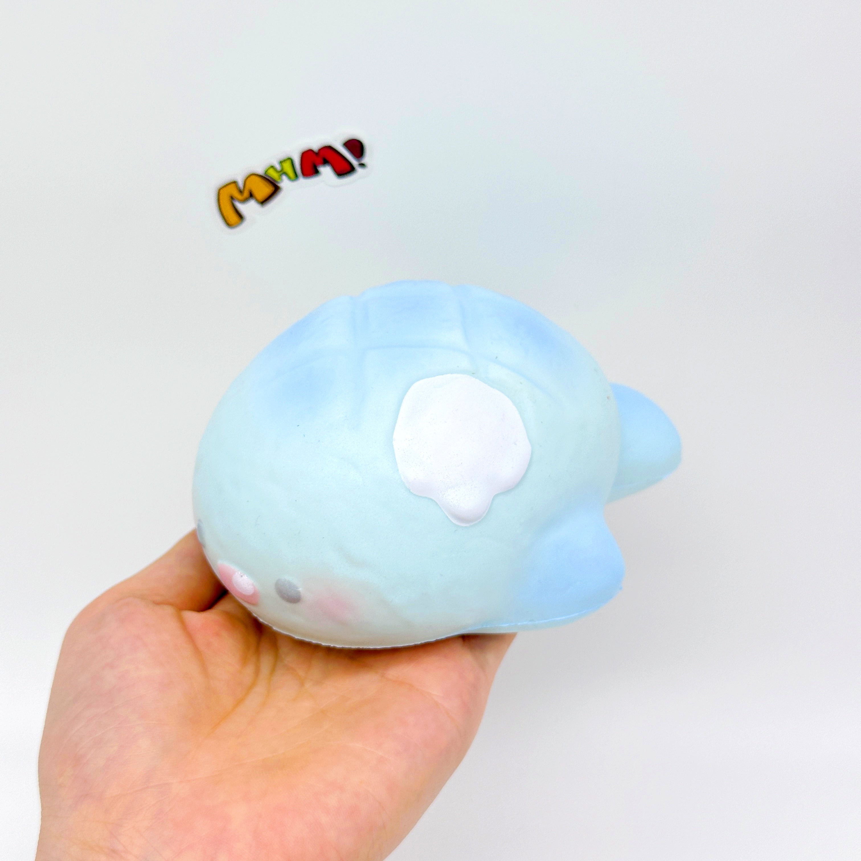 Cute blue shark pineapple bun squishy toy held in hand, slow rising
