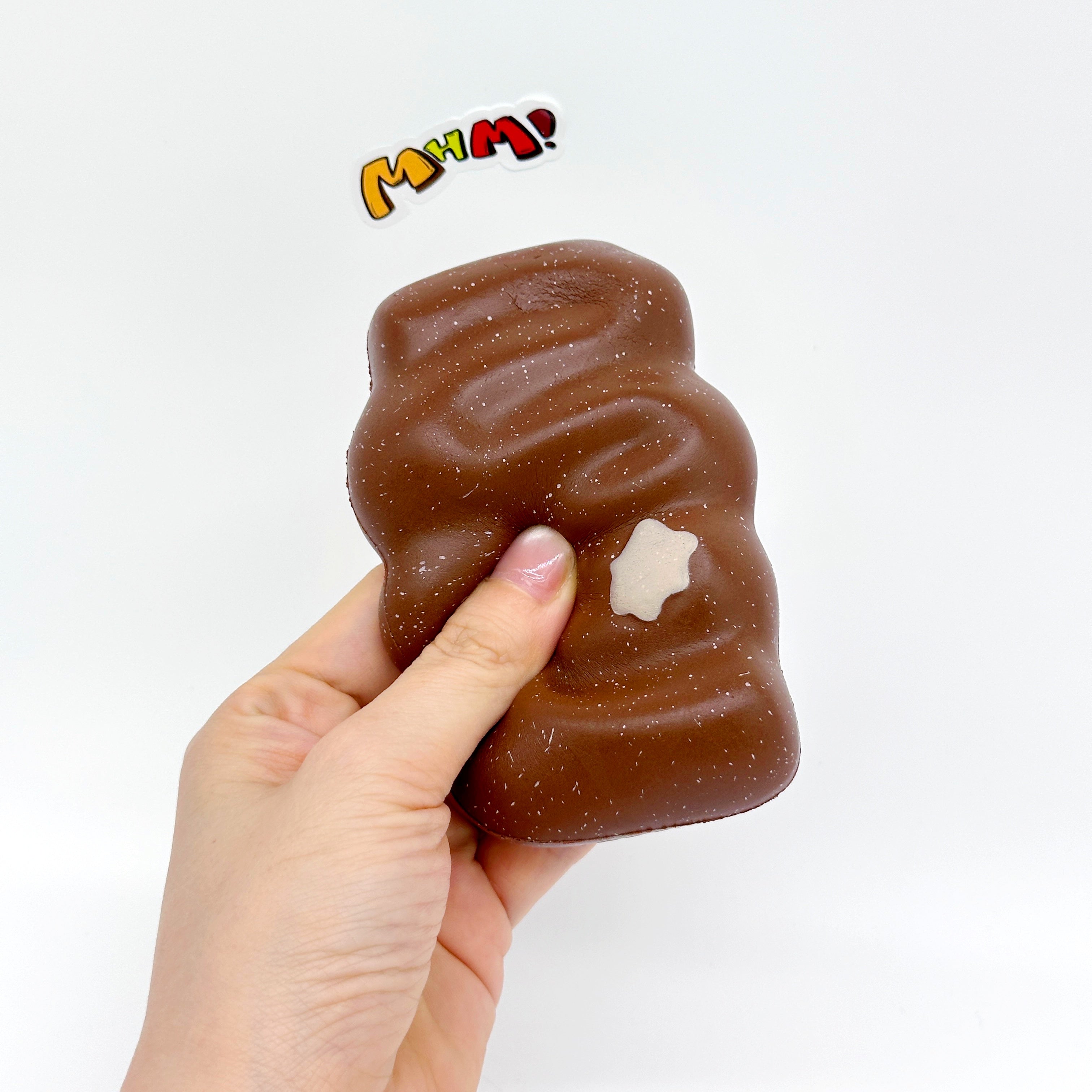 Slow Rise Chocolate Fried Dough Squishy - squishy toy size reference with hand