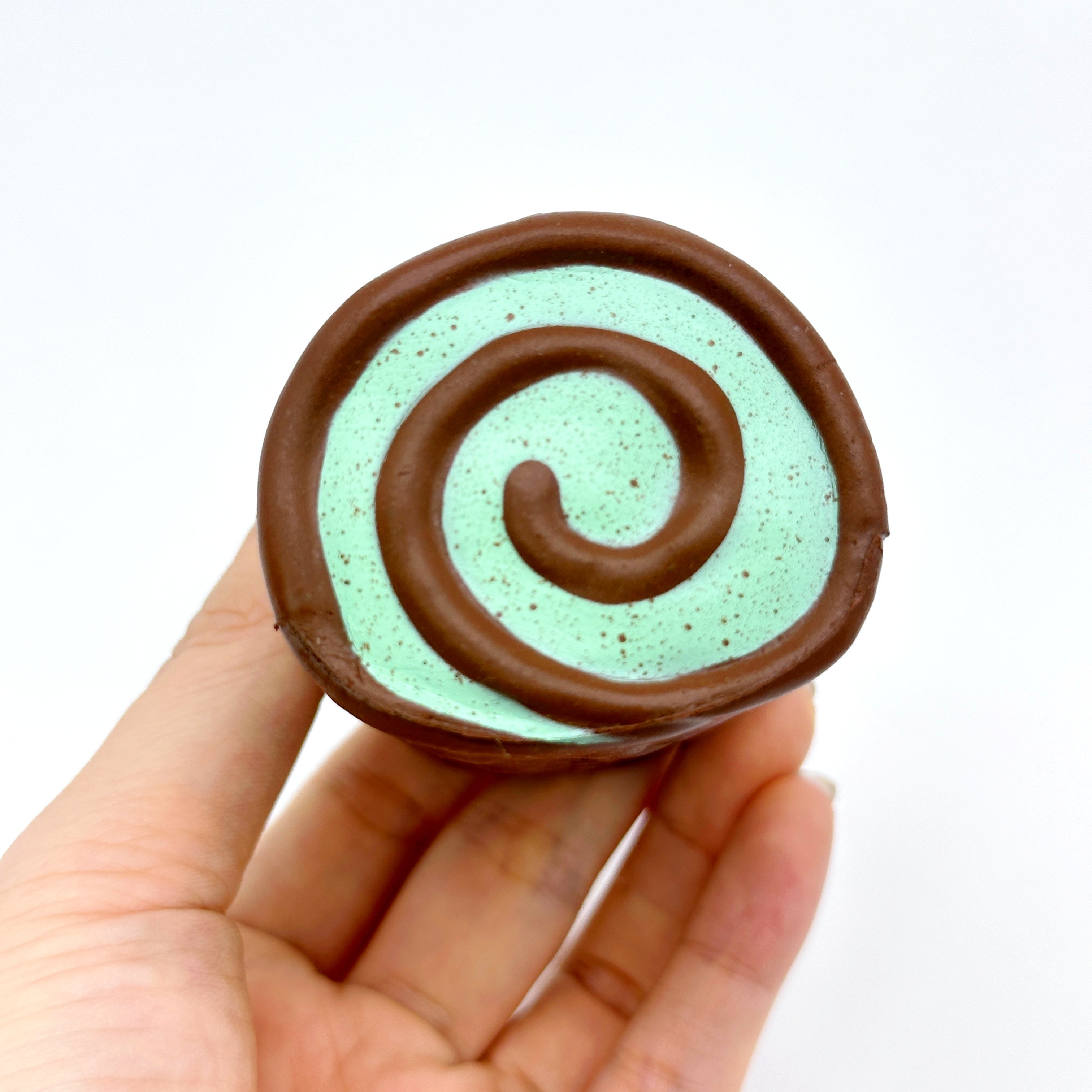 Mint Chocolate Roll Slow Rise Squishy Toy - squishy toy size reference with hand