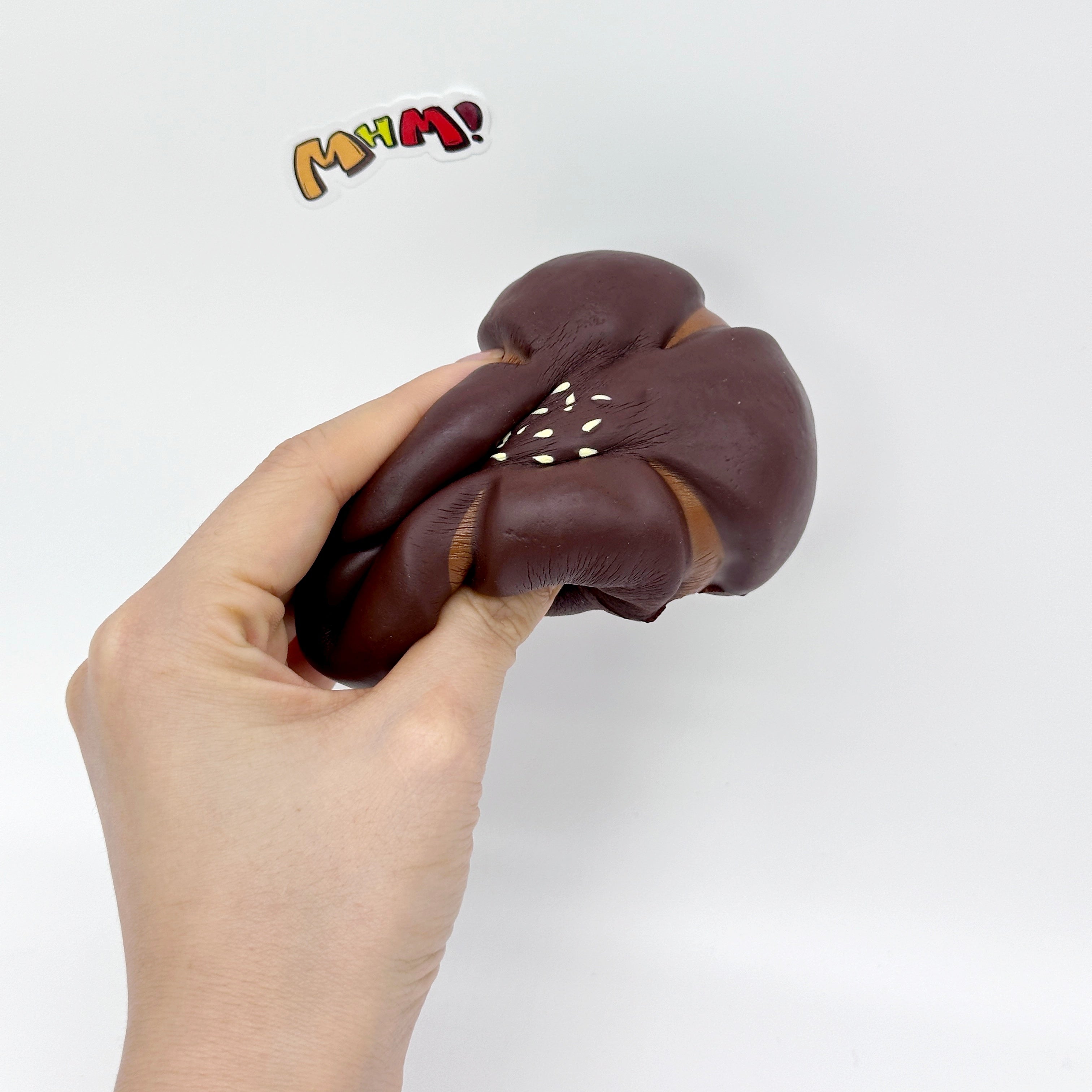 Cute Flower-Shaped Chestnut Pastry Stress Relief Squishy - squishy toy size reference with hand