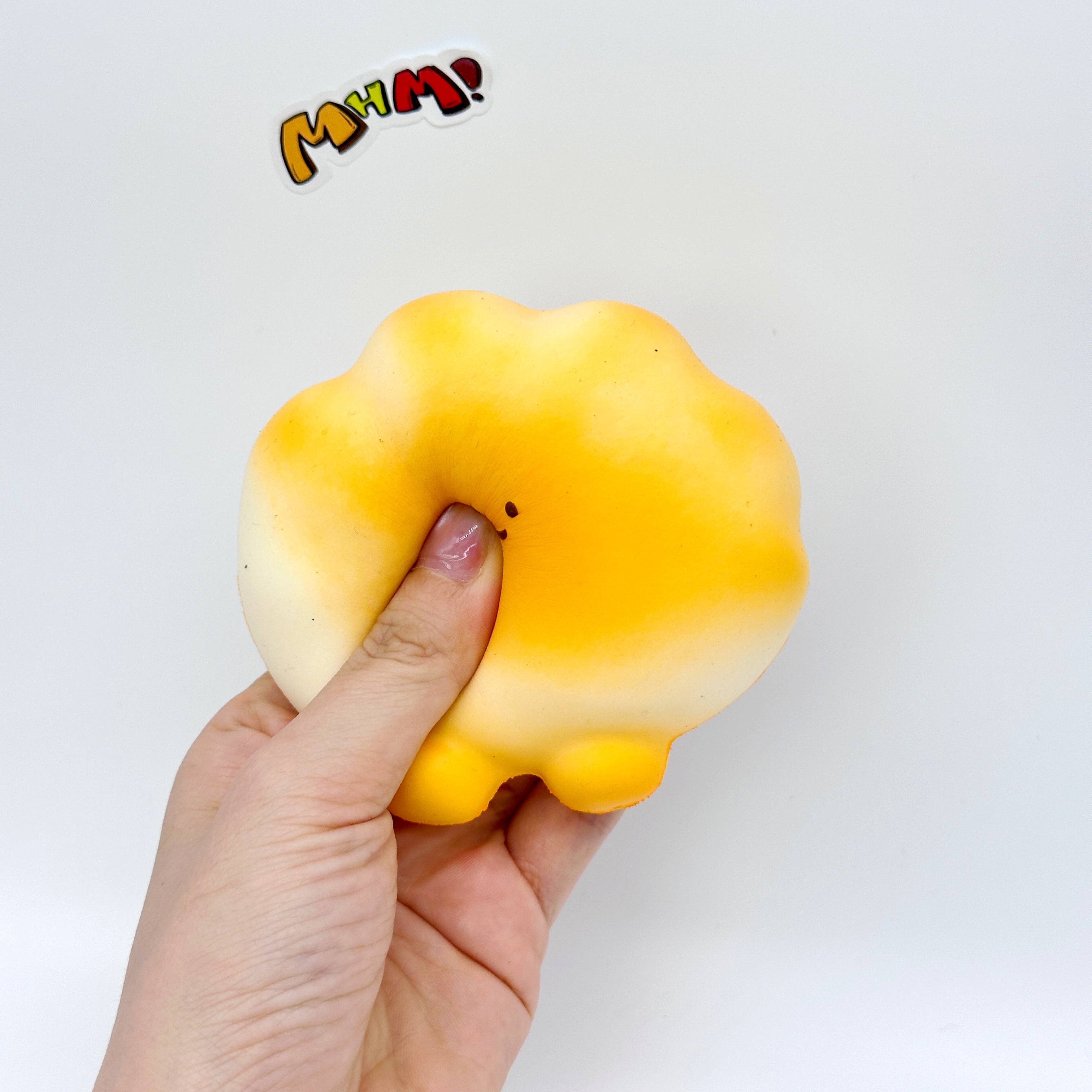 Slow Rise Rainbow Cloud Bread Squishy - squishy toy size reference with hand