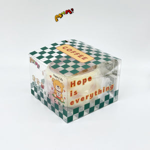 Animal coffee cup squeeze toy in green checkered clear gift box packaging