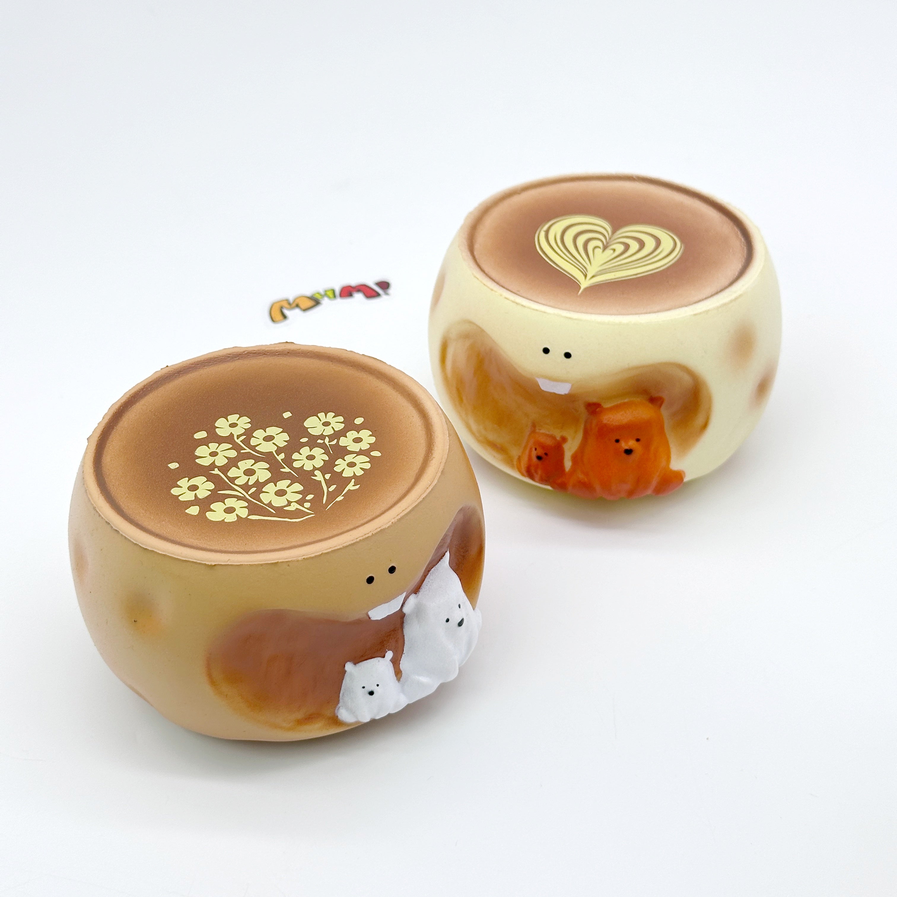 Two bear coffee cup squeeze toys with latte art tops and 3D bear figurines