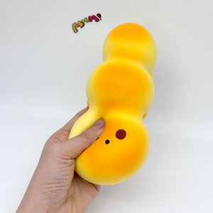 Fluffy Caterpillar Bread Squishy - squishy toy size reference with hand