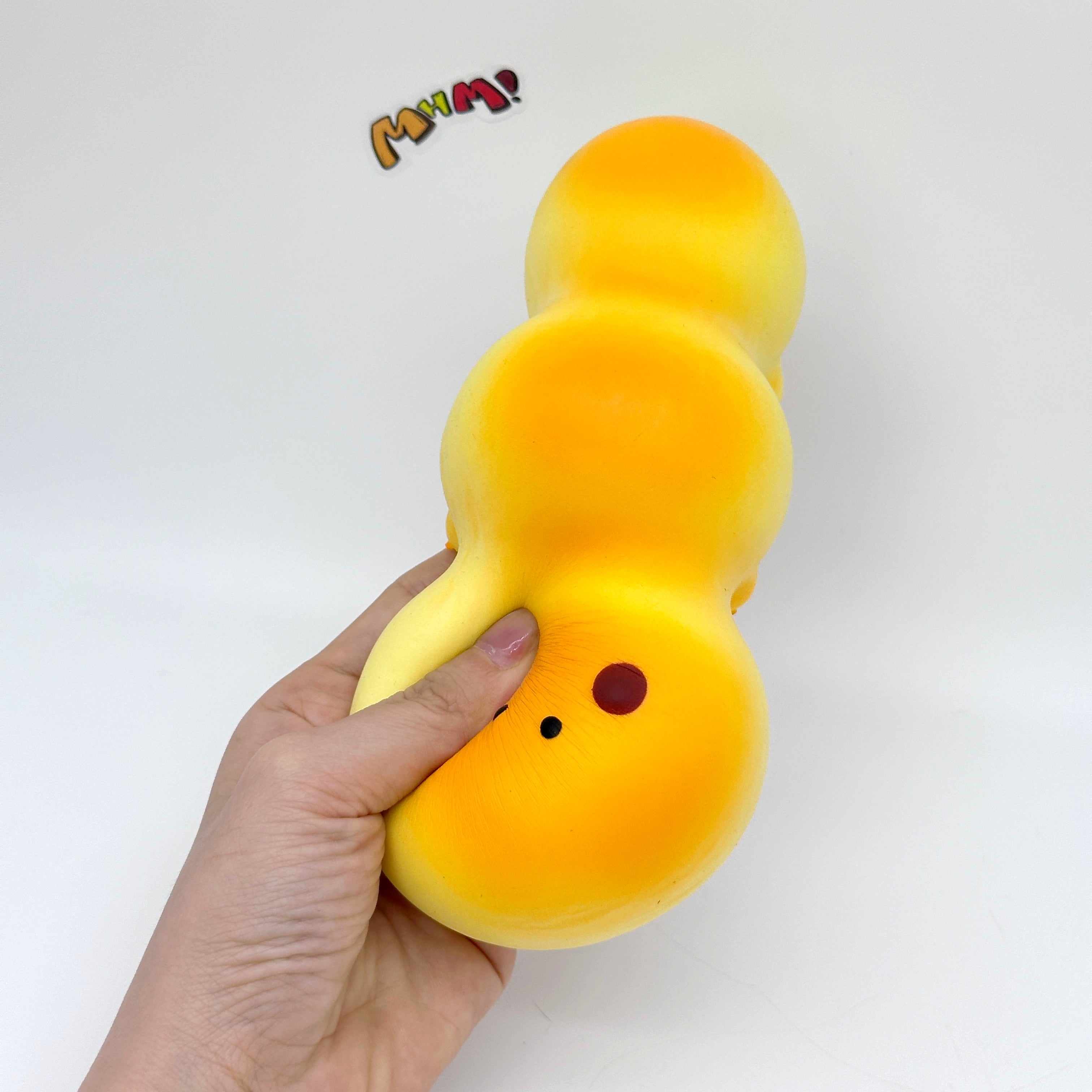 Fluffy Caterpillar Bread Squishy - squishy toy size reference with hand