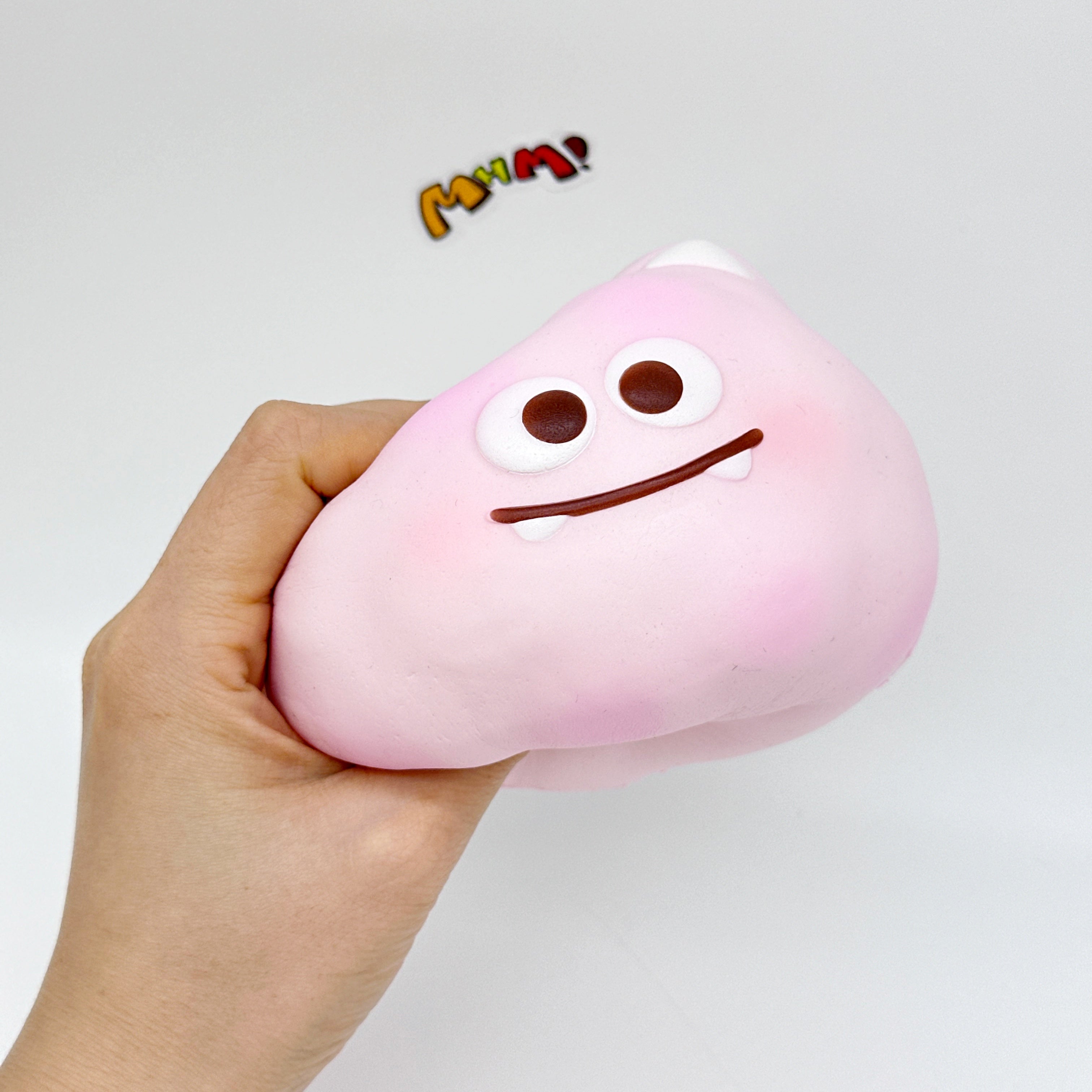 Cute little monster cotton candy, stress-relieving toy squishy - kawaii squishy toy close up