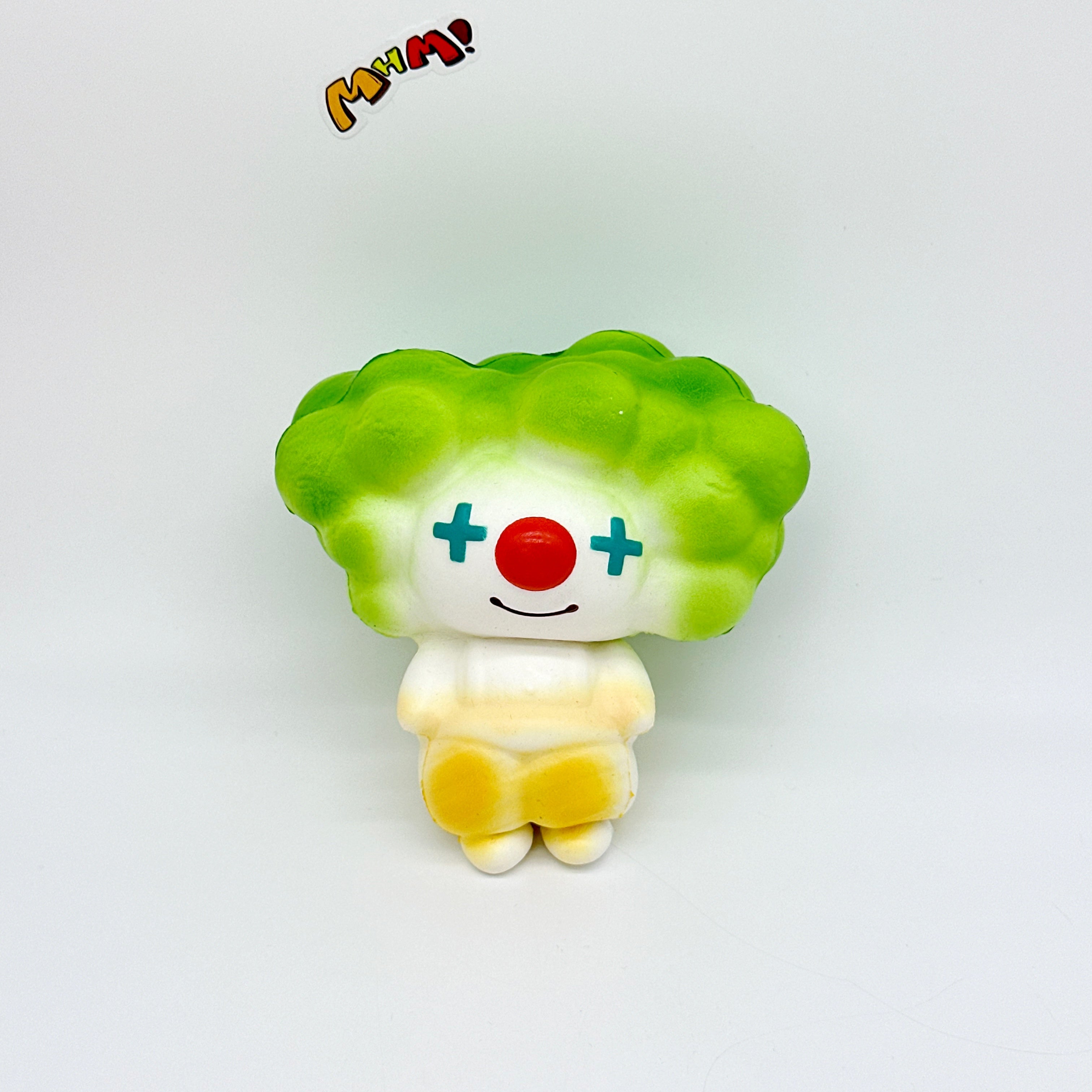 4 Colors Clown Squishy - Orange/Yellow/Green/Blue Cute Circus Slo - slow rising squeeze toy side angle view