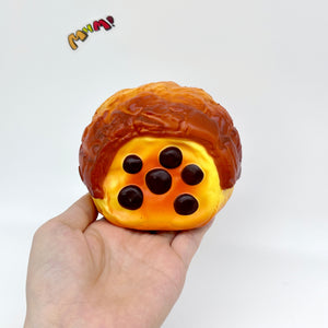 Brown Sugar Pearl Puff Squishy - Soft Cream Bun Slow Rising Squee - slow rising squeeze toy side angle view