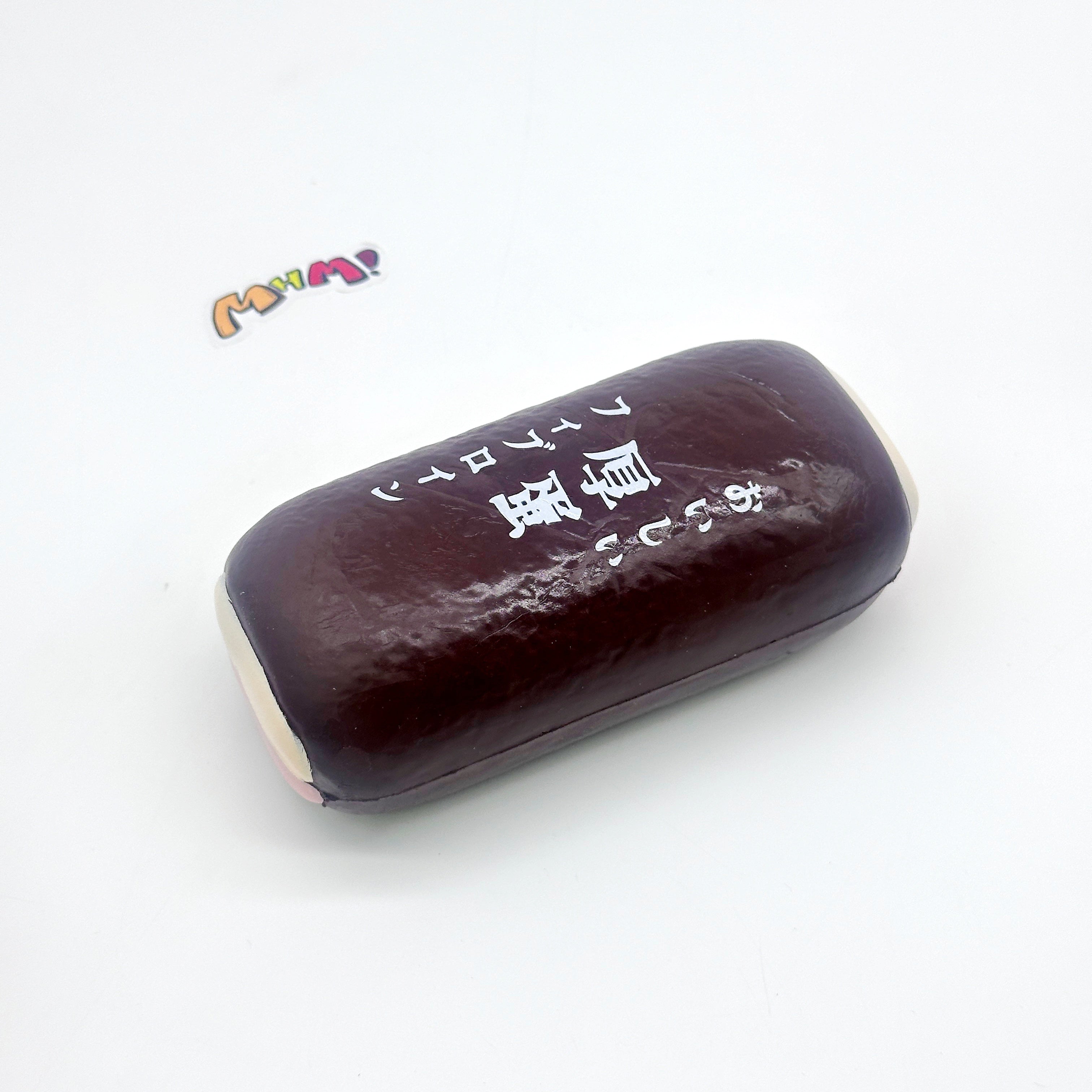 Tamagoyaki Squishy - Yellow & Chocolate Japanese Thick Egg Omelet - slow rise fidget toy texture close up