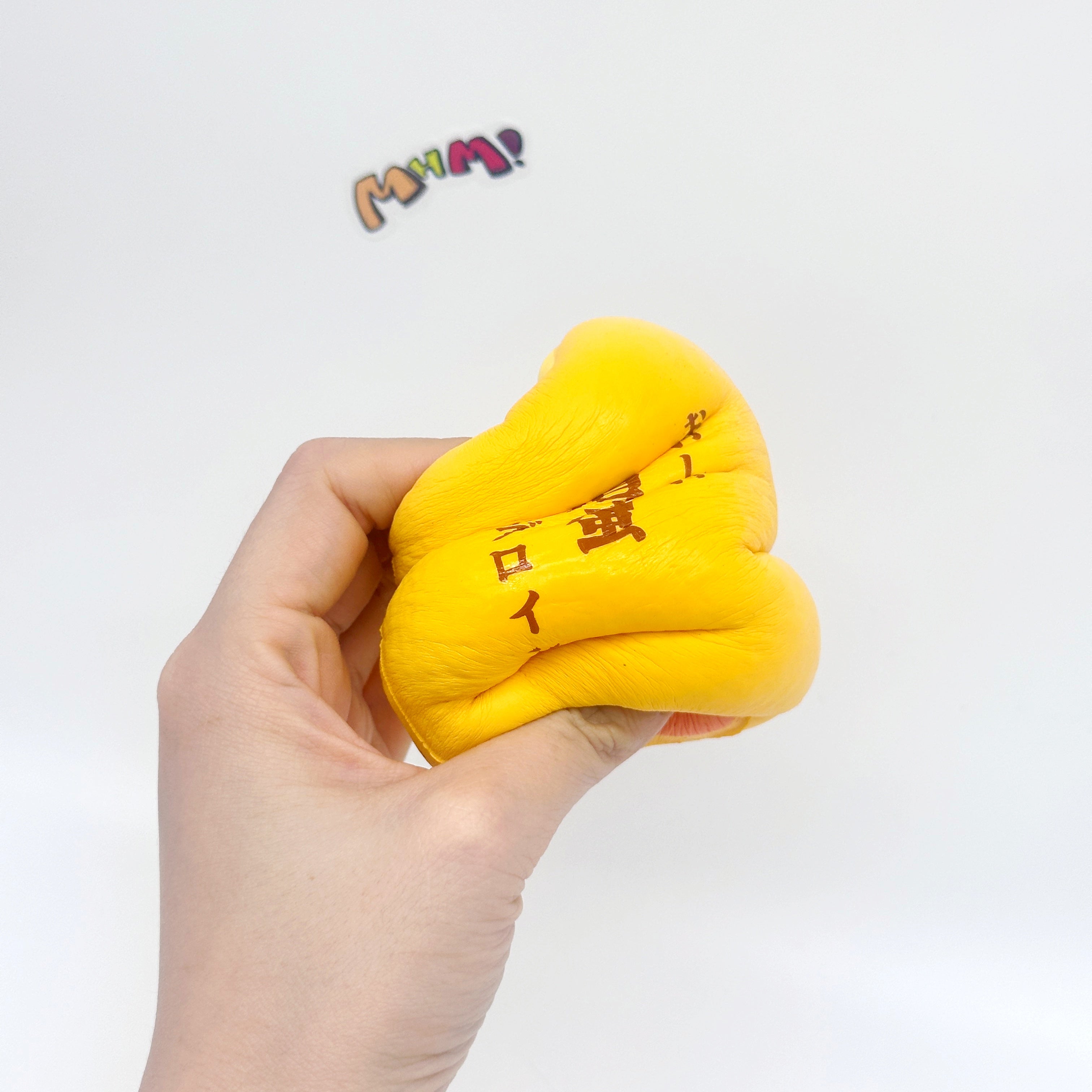 Tamagoyaki Squishy - Yellow & Chocolate Japanese Thick Egg Omelet - slow rising toy top view