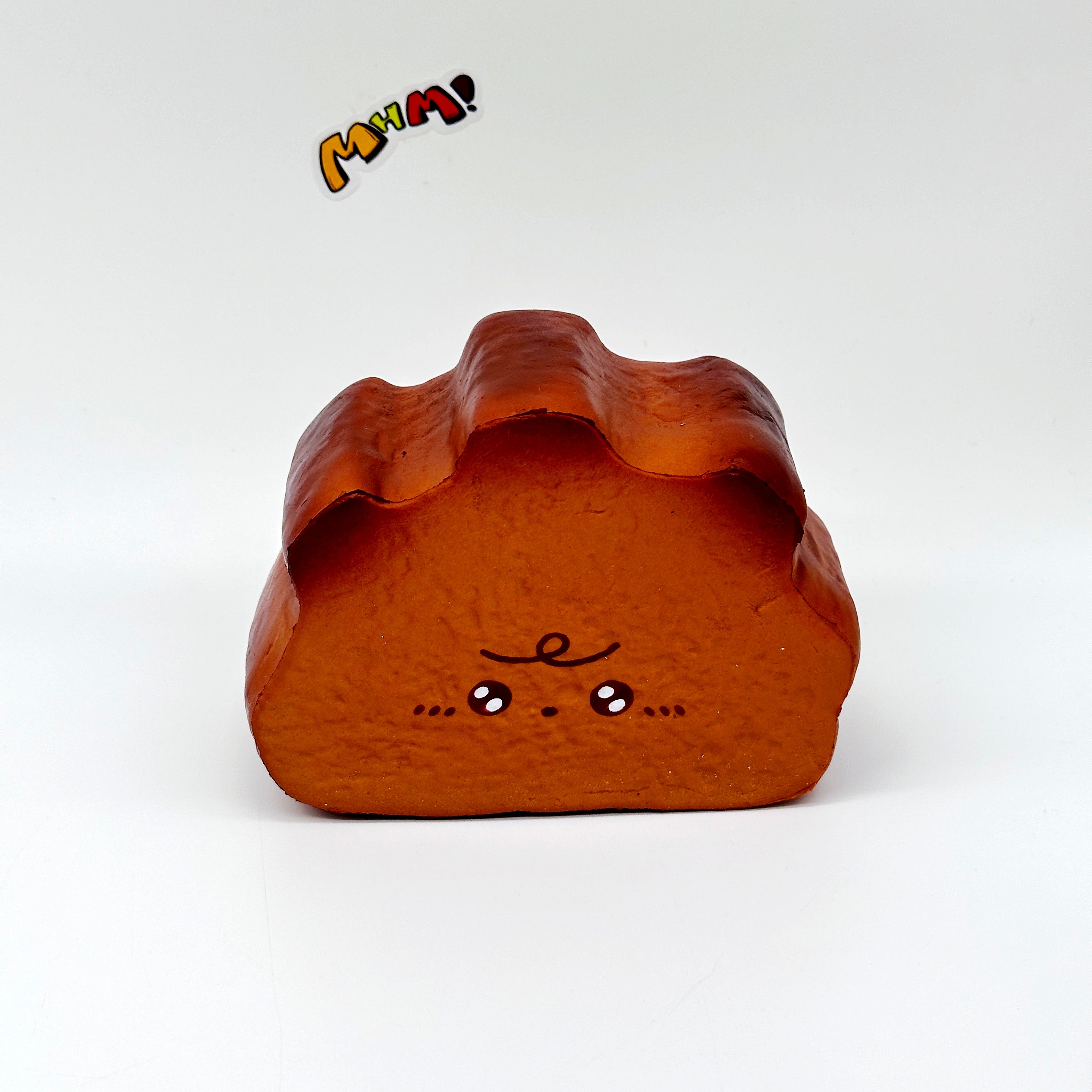 Milk Haas Bread Squishy - Chocolate Brown & Original Bread Yellow - slow rising squeeze toy side angle view
