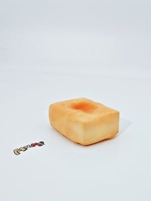 Golden toasted mochi block squishy toy sticky chewy texture yellow rice cake fidget