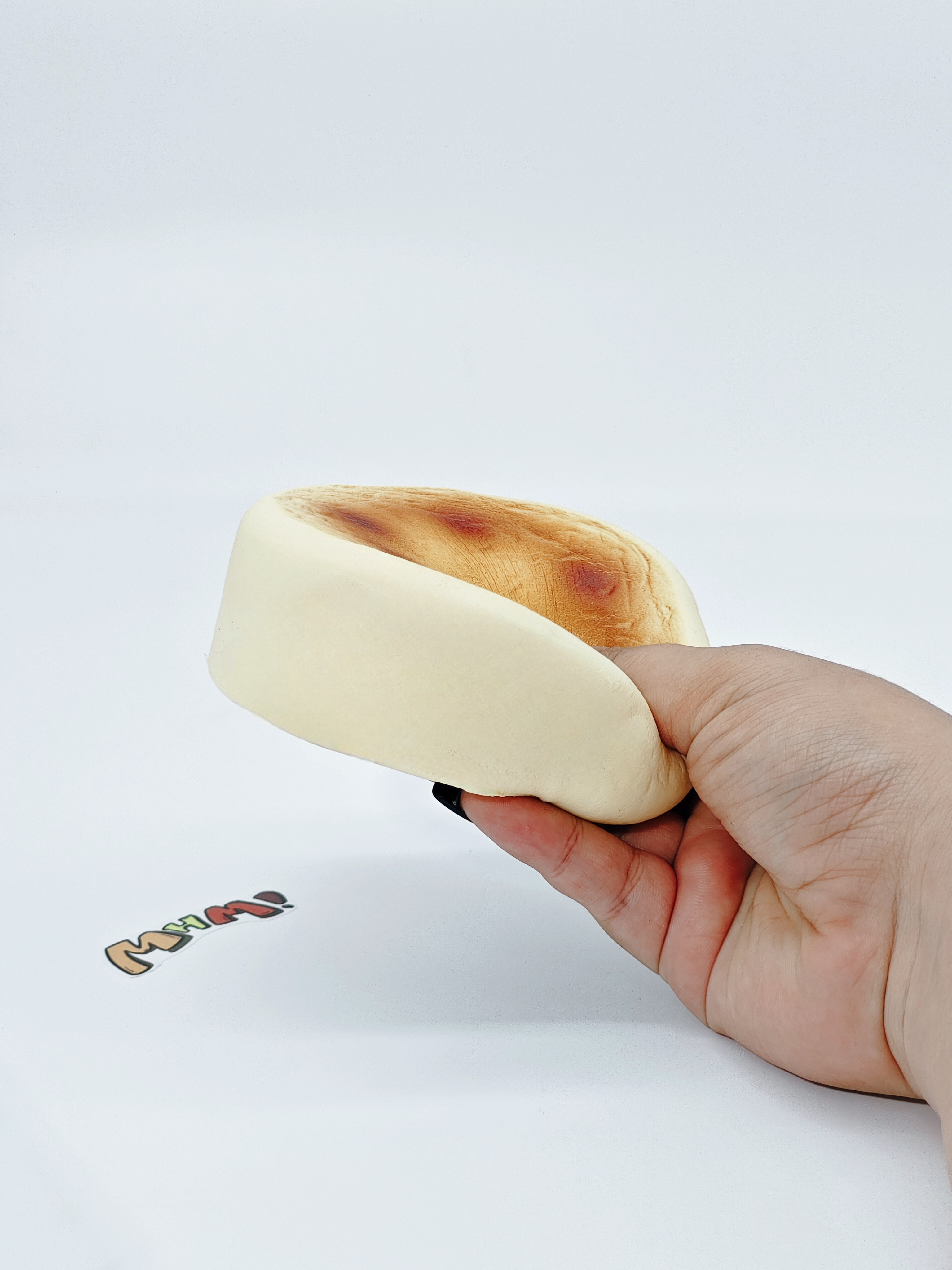 Basque Cheesecake Squishy | Dessert Themed Slow Rising Stress Rel - slow rising squeeze toy side angle view